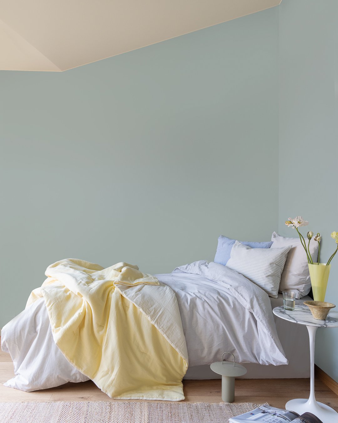 Bedroom with walls painted in light bluegreen JOTUN 6378 Iconic and ceiling in beige with JOTUN 12308 Unbleached.