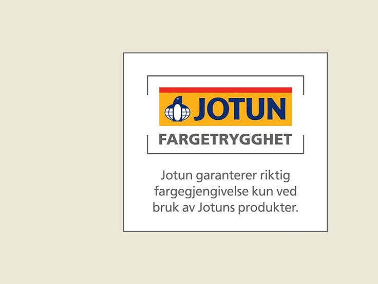 Logo med påskriften Jotun Fargetrygghet. Jotun garanterer riktig fargegjengivelse kun ved bruk av Jotuns produkter.