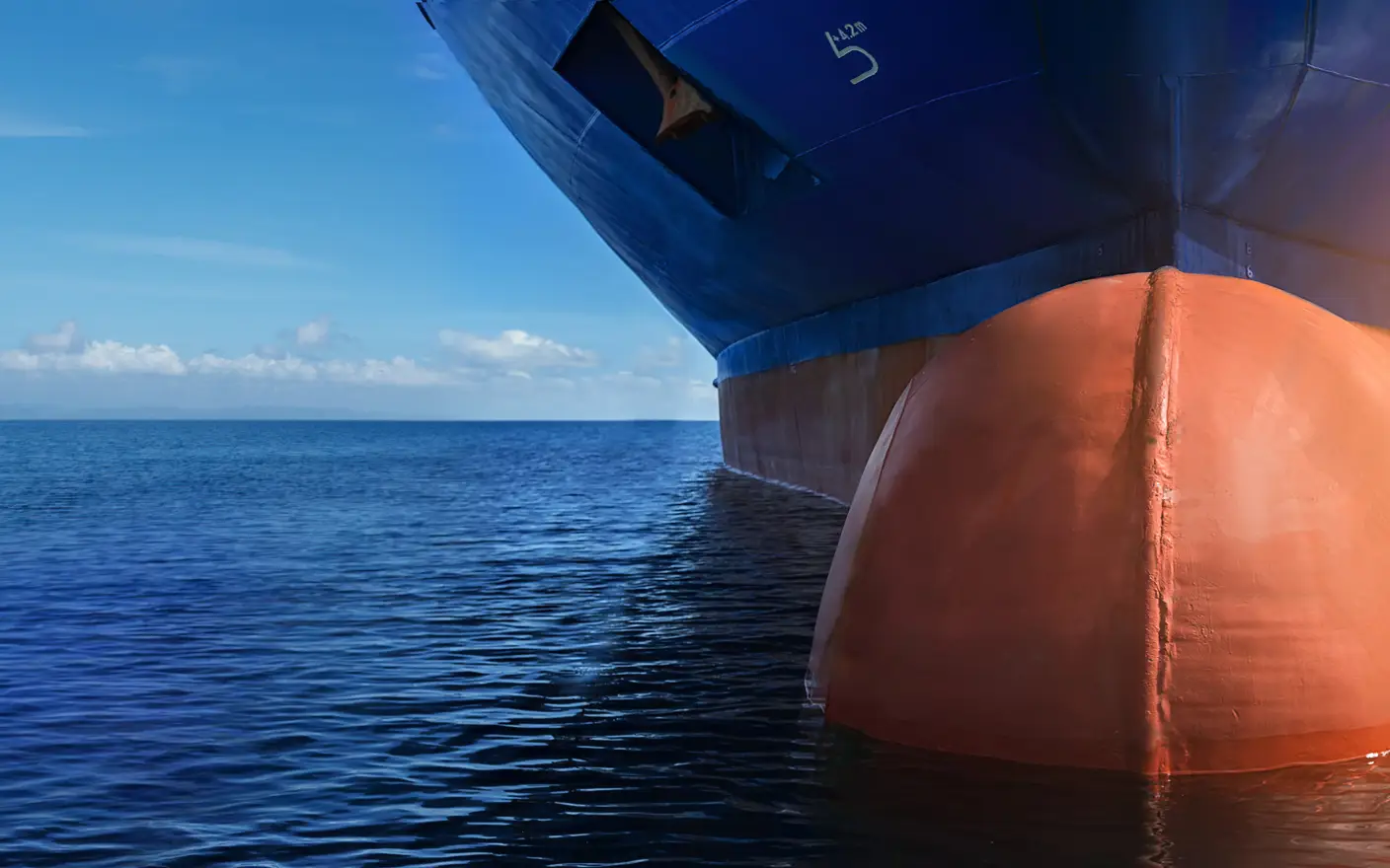 The hull of a ship being coated