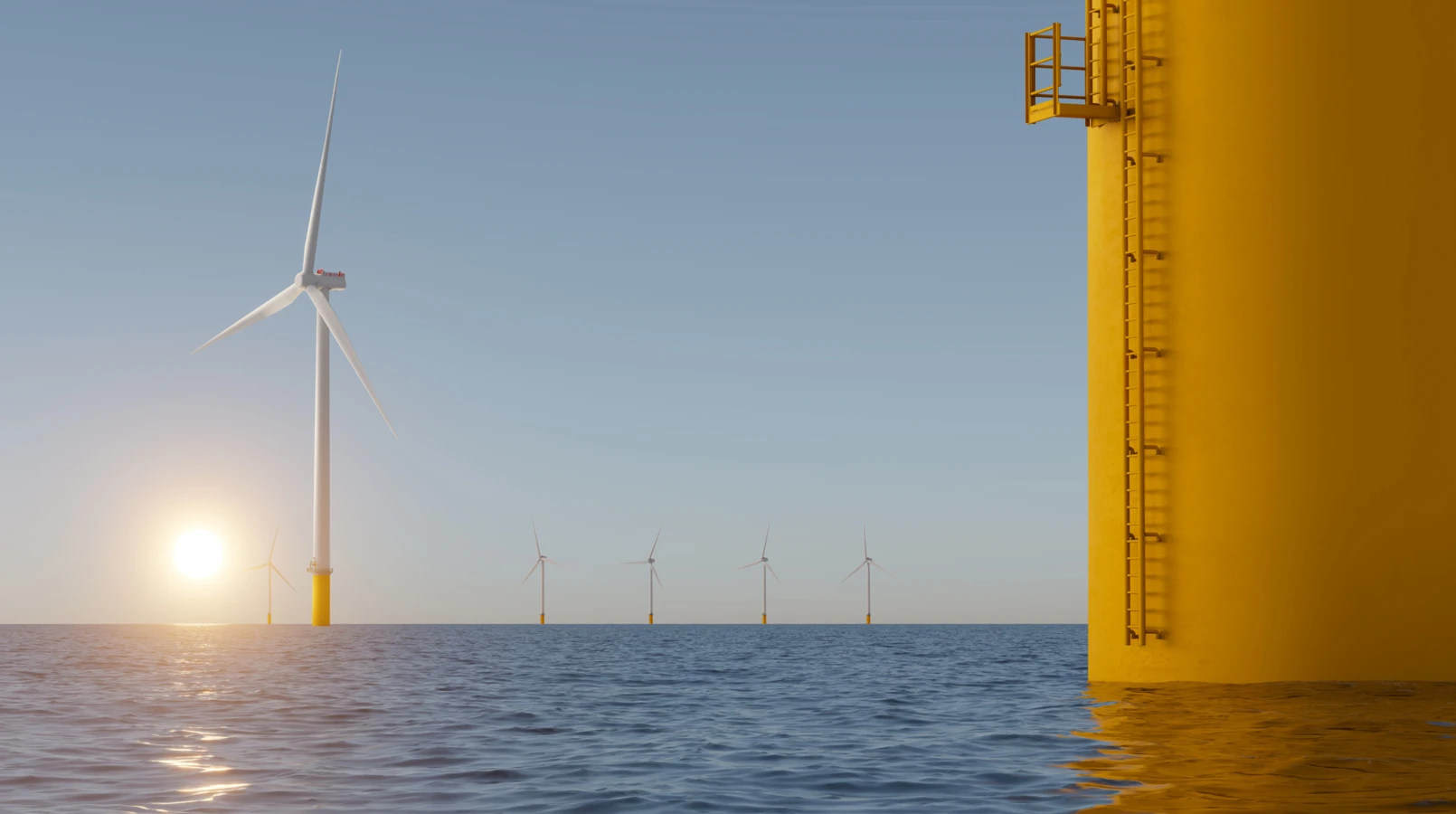 Offshore wind turbines at sunrise with a yellow foundation structure in the foreground.