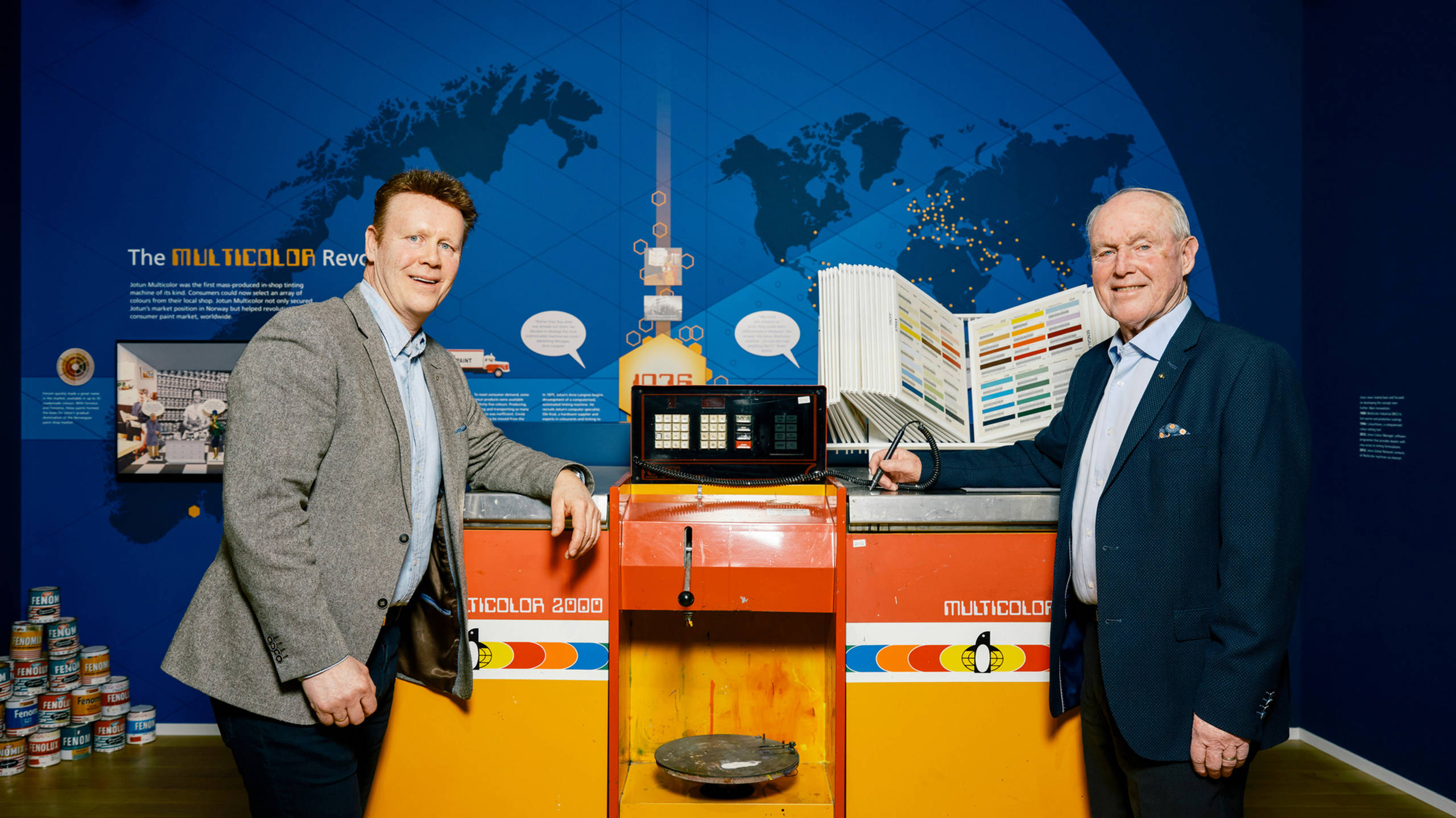 Arild (left) and his father Arne Langnes in front of a first-generation Jotun Multicolor Machine at Group HQ in Sandefjord, Norway. Photo: Morten Rakke
