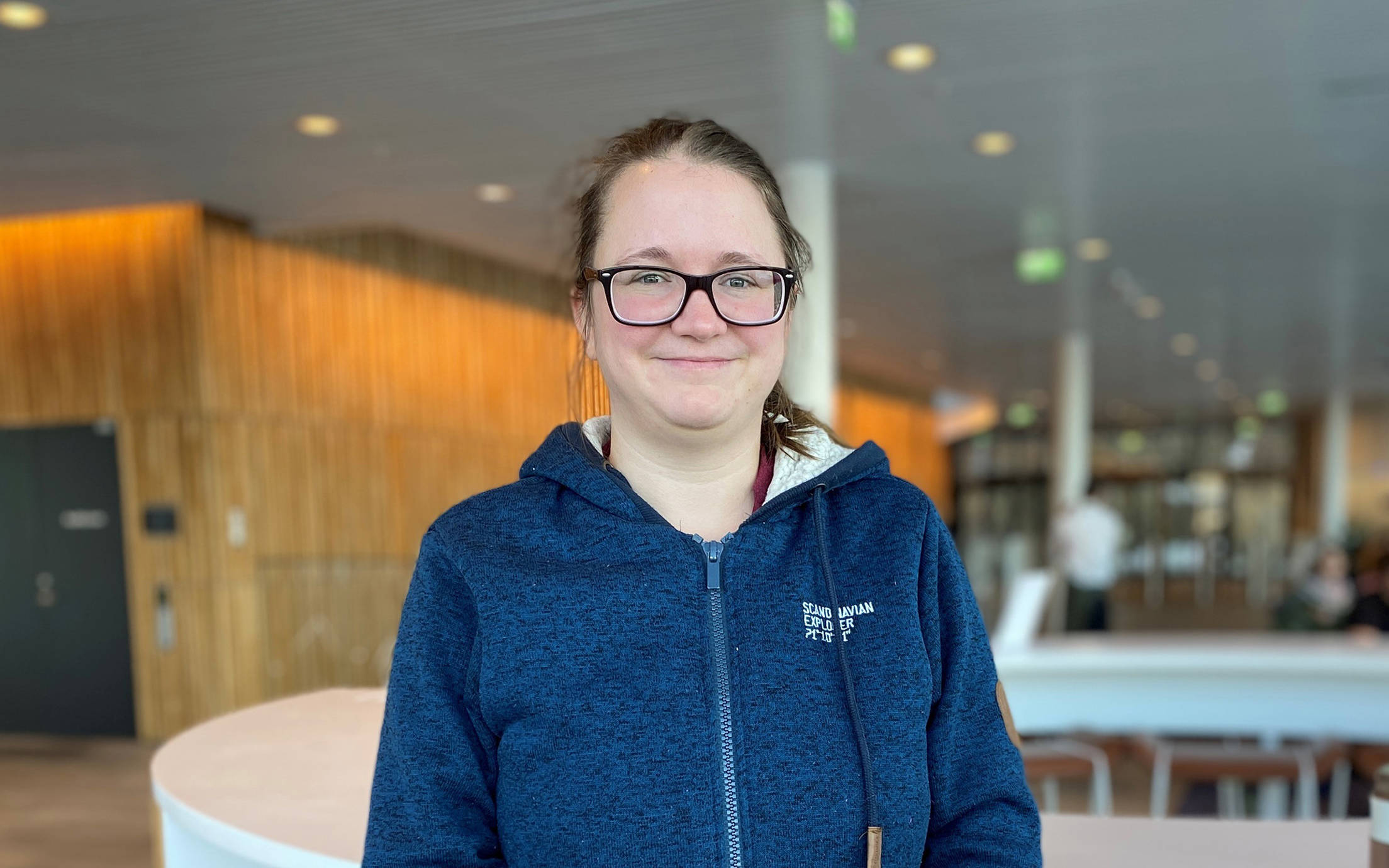 Woman in the café area at Jotun Headquarter in Norway