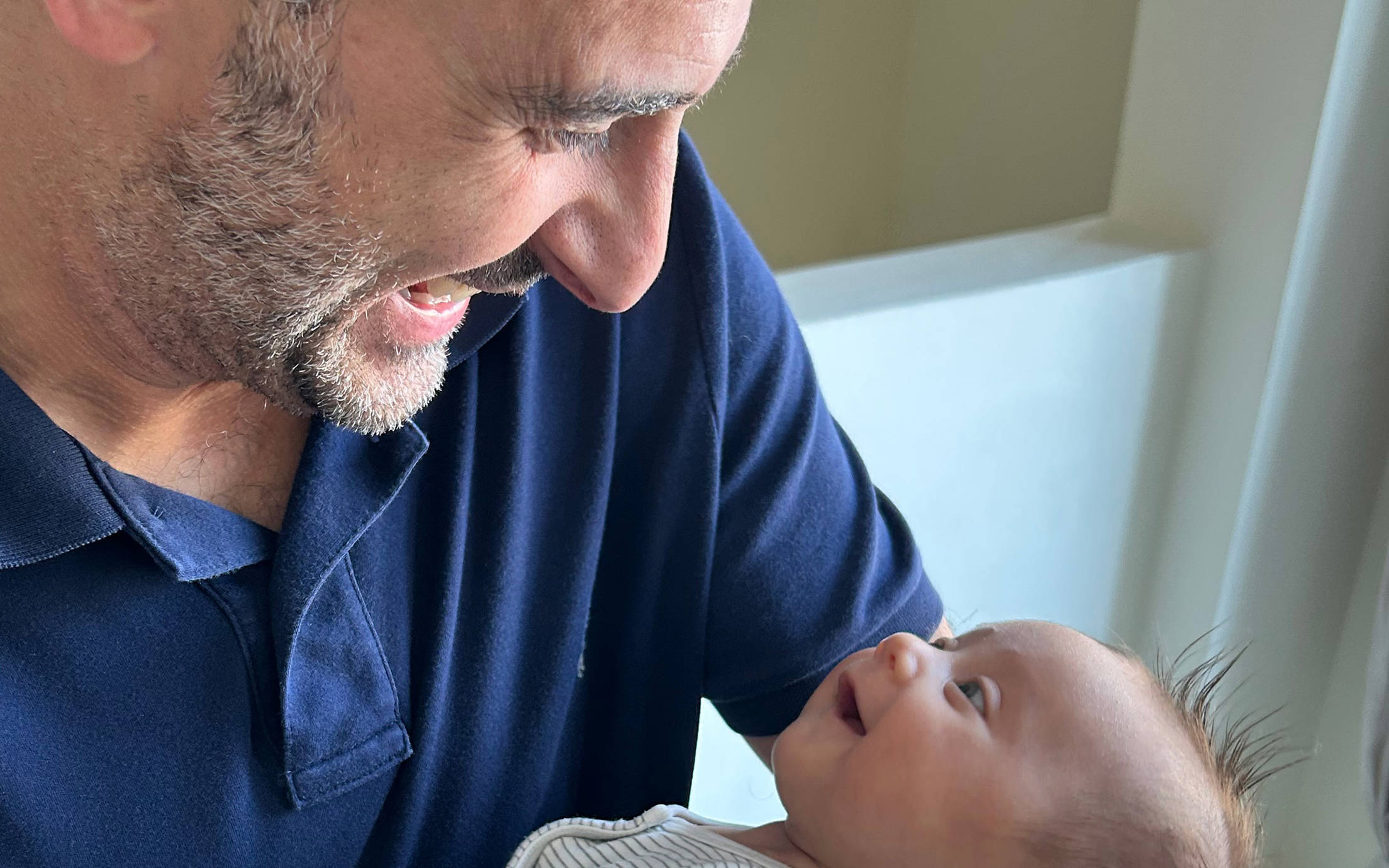 Smiling father with happy baby