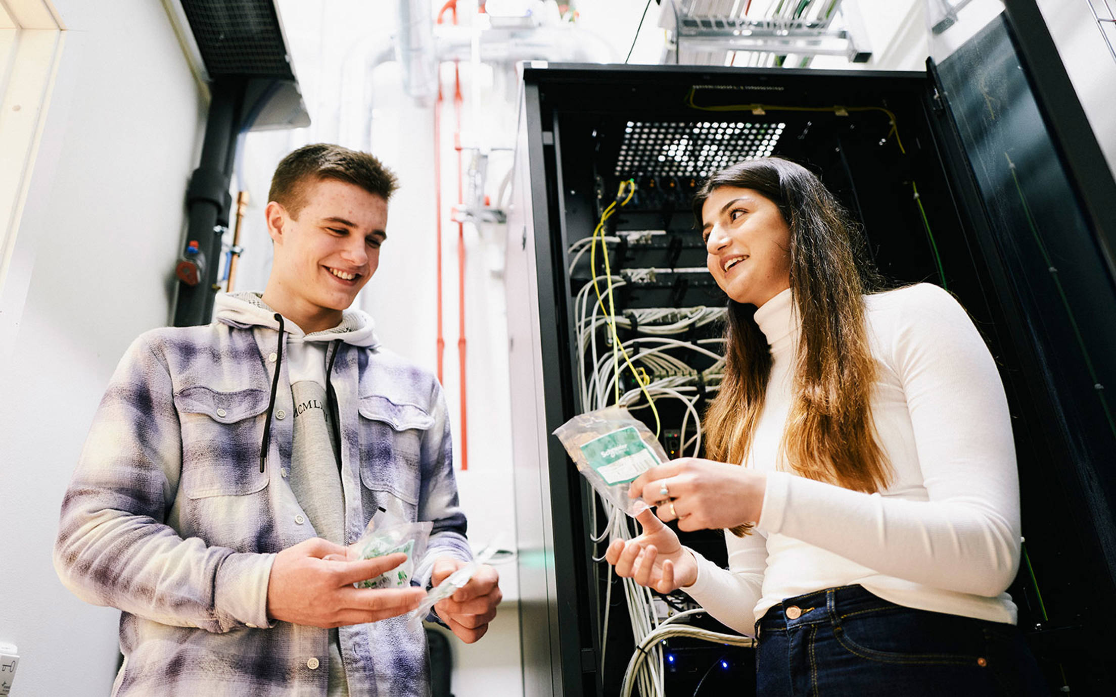 Two young apprentices in the IT department at the headquarter in Norway